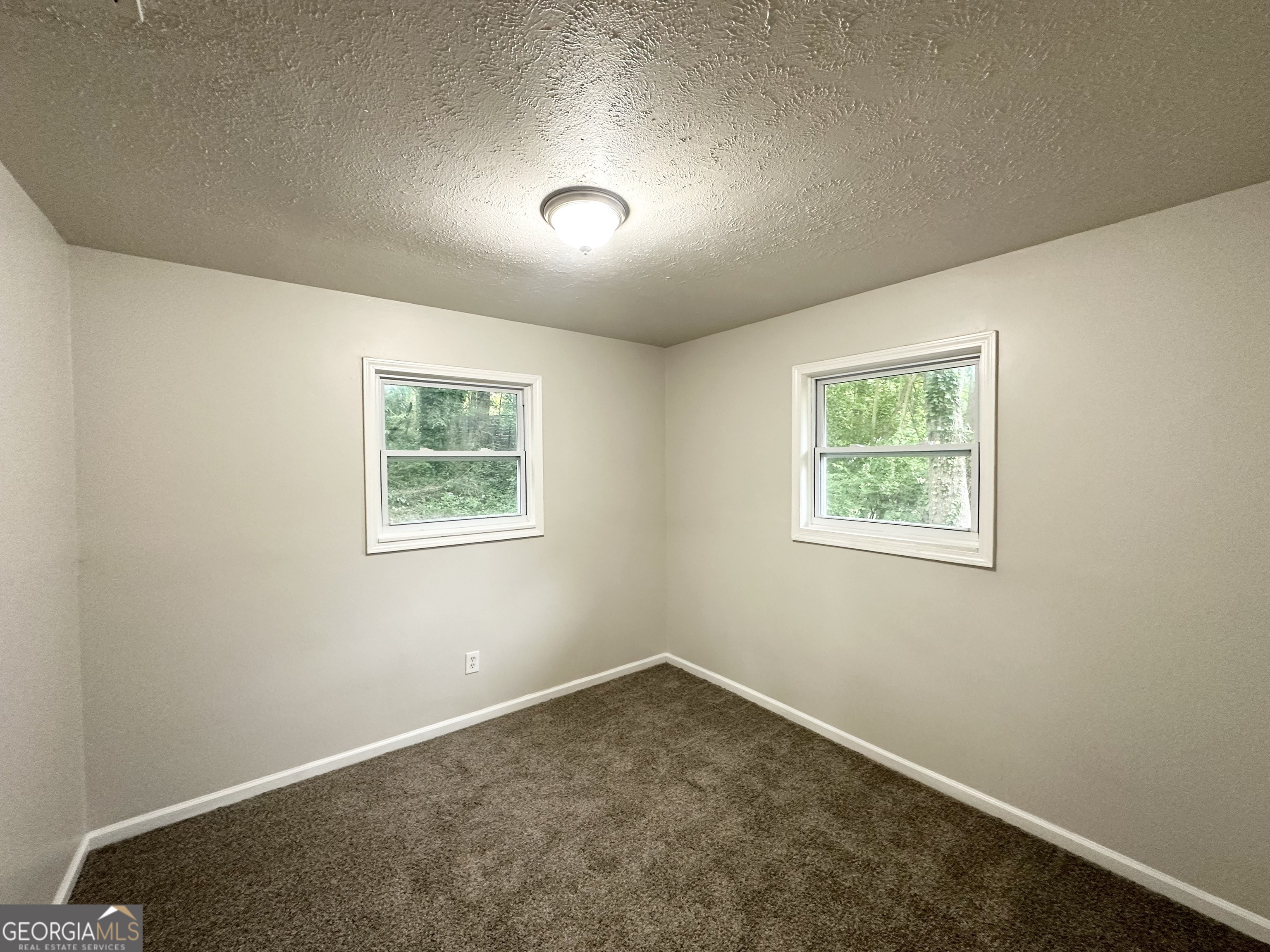 2930 Waters Road Southwest Atlanta, GA 30354 - Photo 8 of 14 an empty room with a window