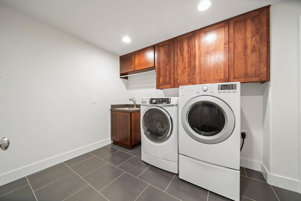 805 Riverside Drive Old Hickory, TN 37138 - Photo 23 of 28 Spacious laundry room has utility sink, hanging space and laundry shute.