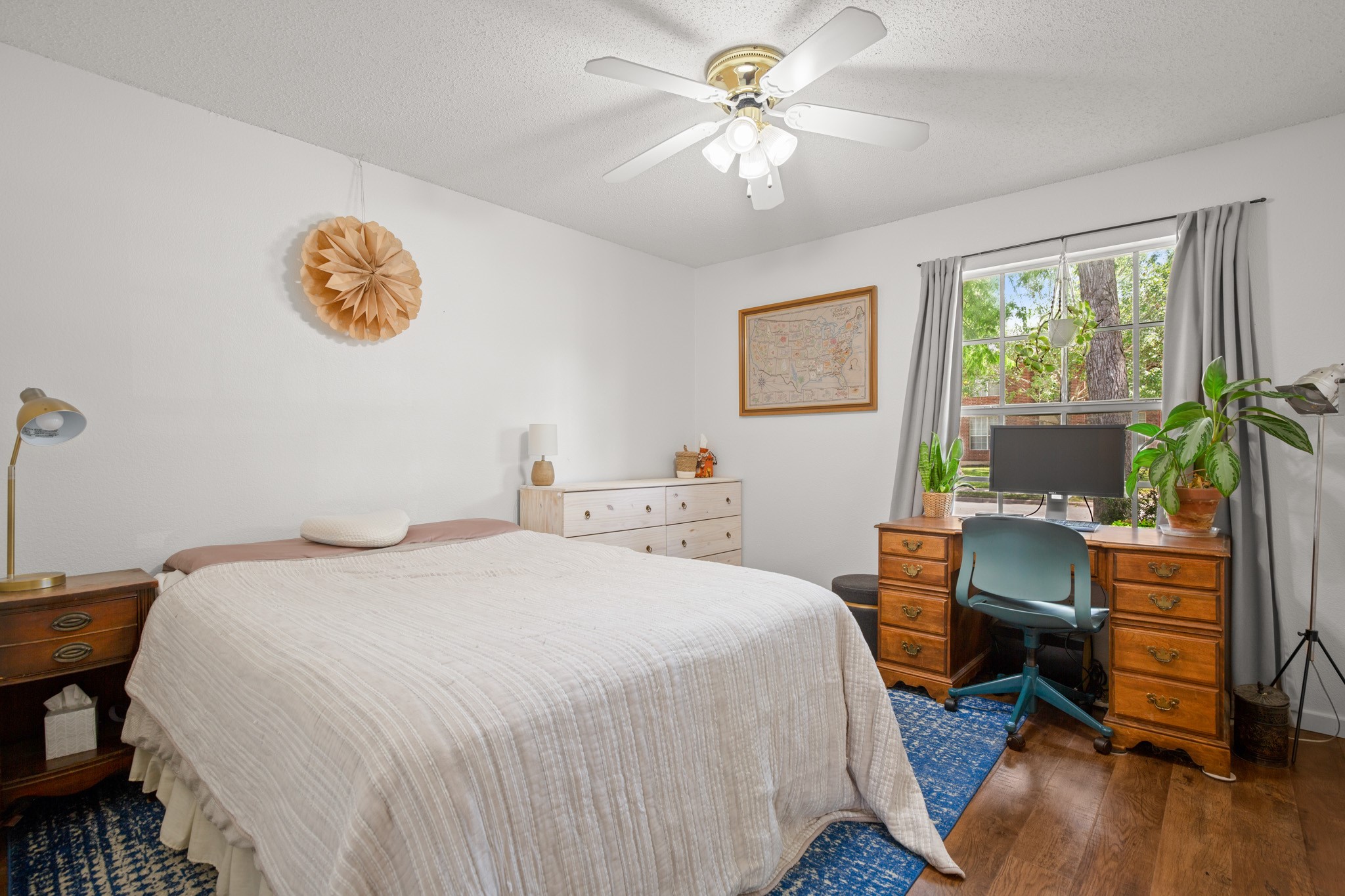 1205 Crossvine Way Pflugerville, TX 78660 - Photo 13 of 20 a bedroom with a bed a computer on a desk and chair