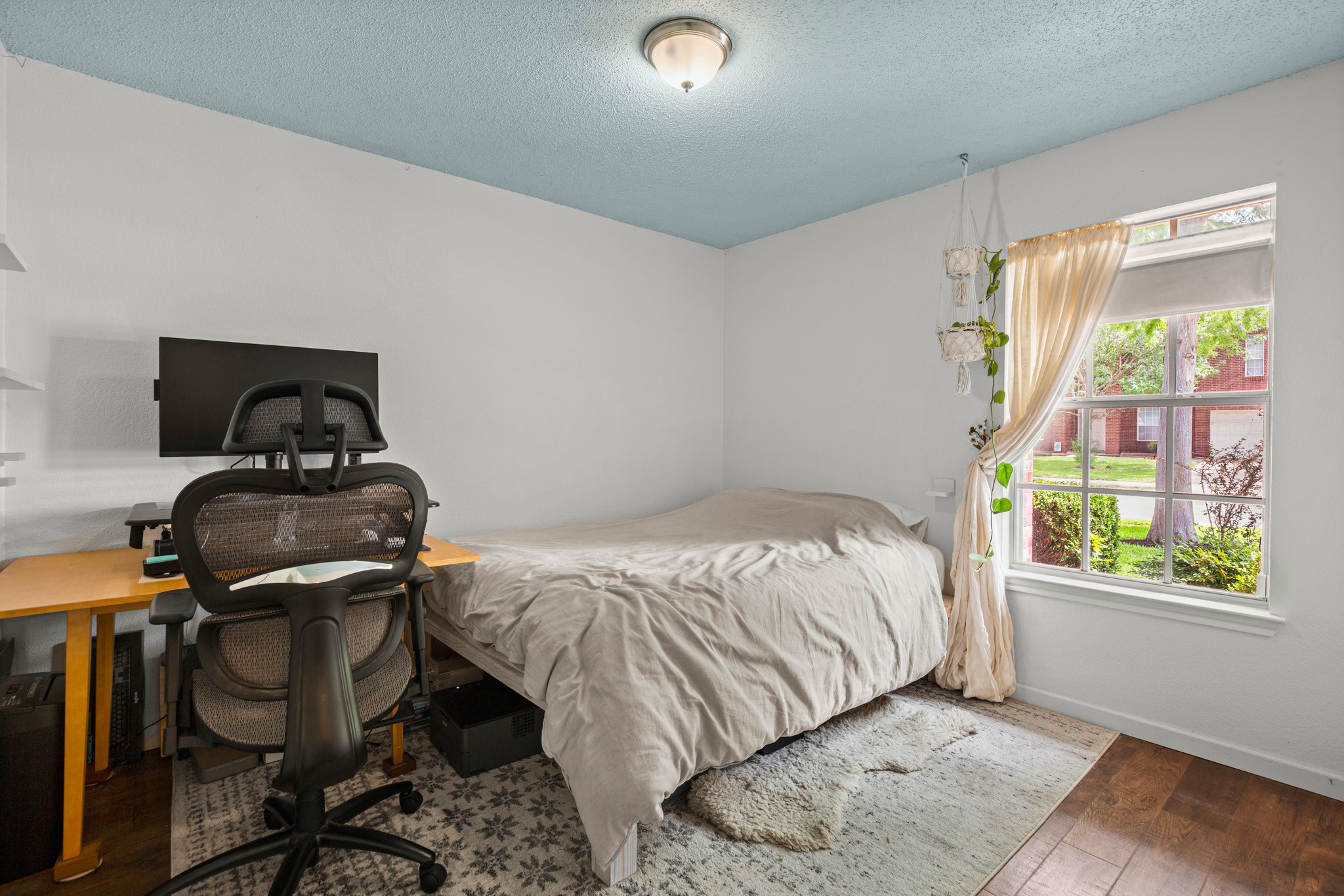 1205 Crossvine Way Pflugerville, TX 78660 - Photo 15 of 20 a bedroom with a bed and a window