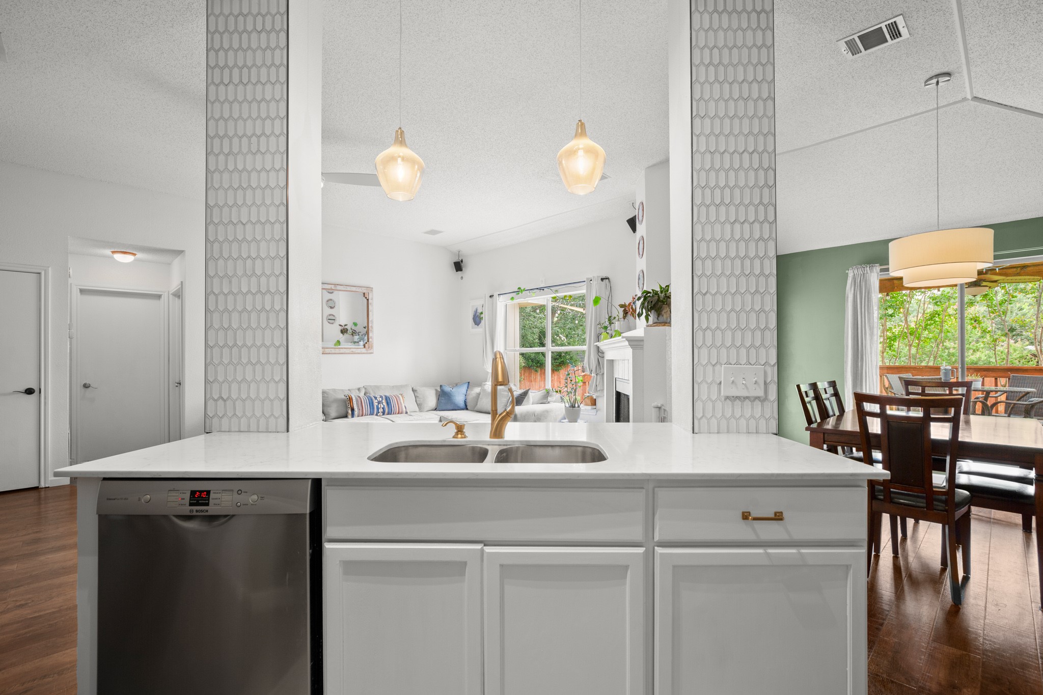 1205 Crossvine Way Pflugerville, TX 78660 - Photo 7 of 20 a bathroom with a sink and a large mirror with wooden floor