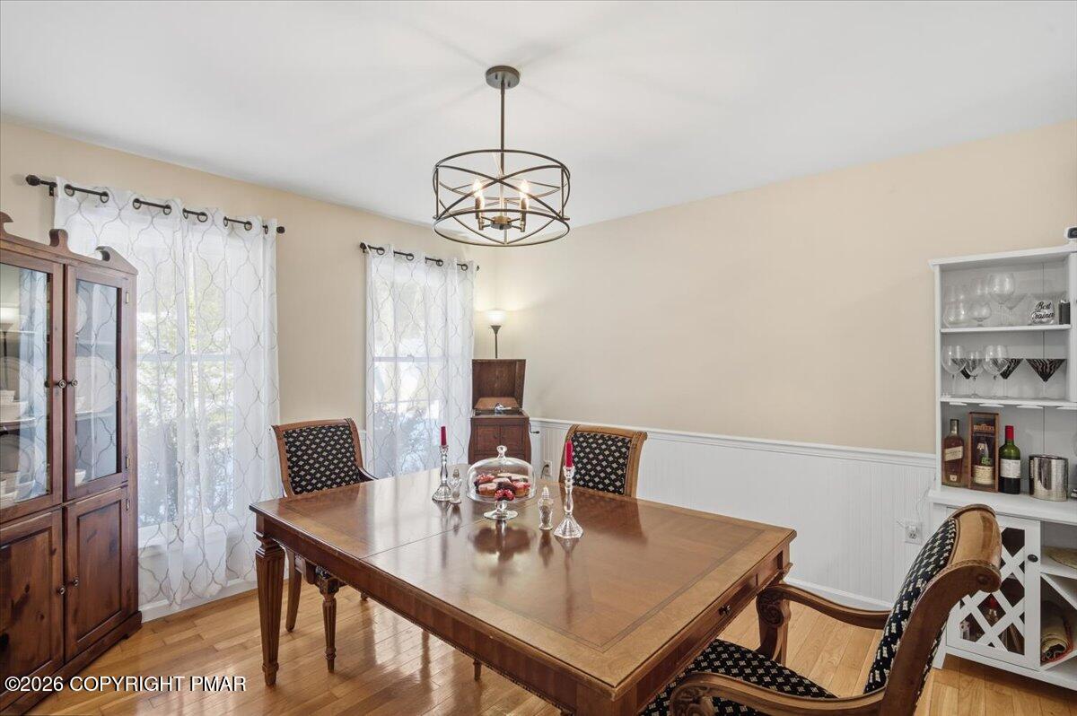 8824 Laird Road Stroudsburg, PA 18360 - Photo 14 of 53 a view of a dining room with furniture window and wooden floor