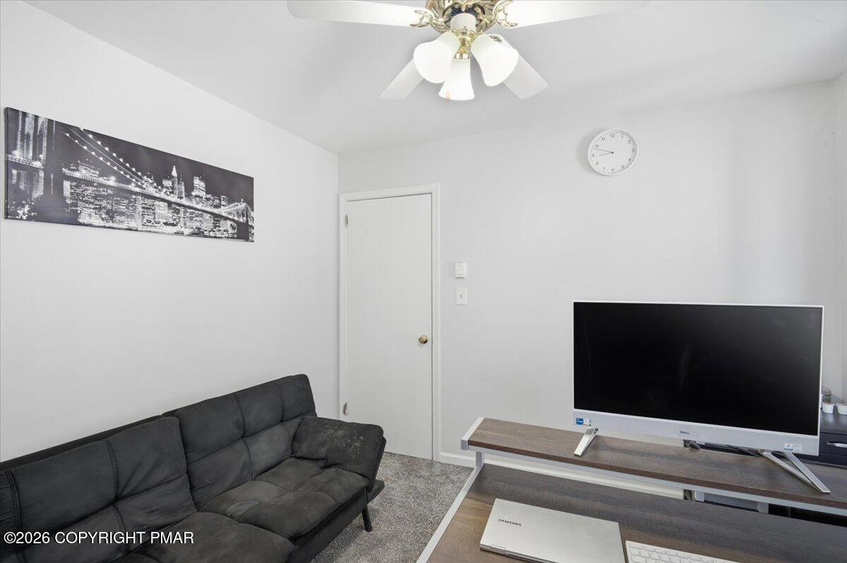 8824 Laird Road Stroudsburg, PA 18360 - Photo 18 of 53 a living room with furniture and a flat screen tv