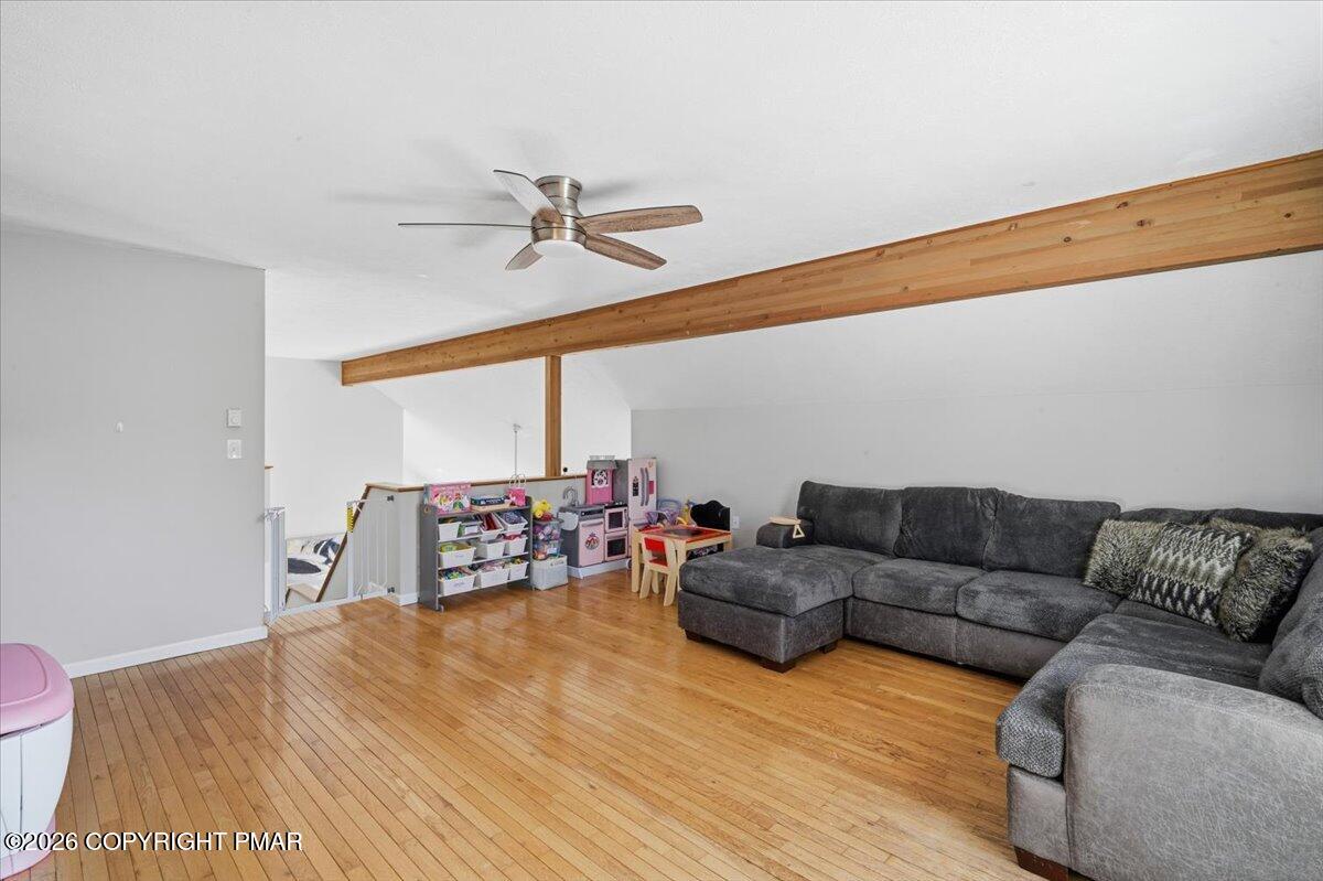 8824 Laird Road Stroudsburg, PA 18360 - Photo 19 of 53 a living room with furniture and a wooden floor