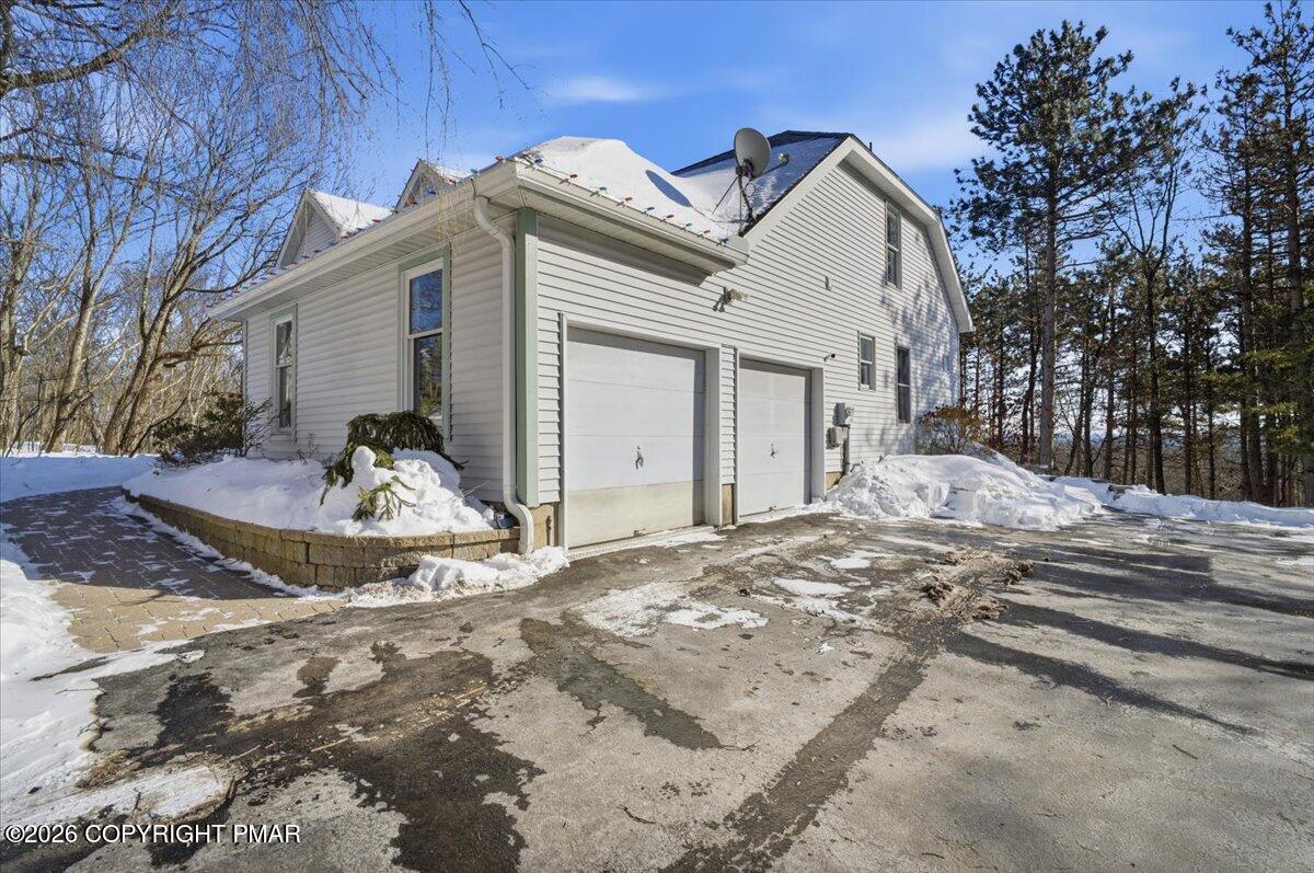 8824 Laird Road Stroudsburg, PA 18360 - Photo 24 of 53 a view of a house with a yard covered in snow