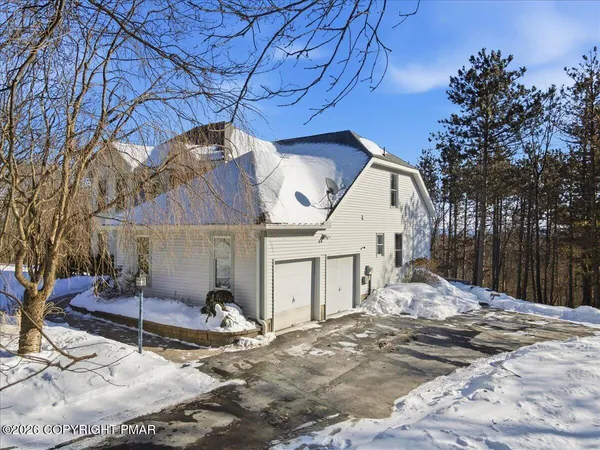 a house with trees in front of it