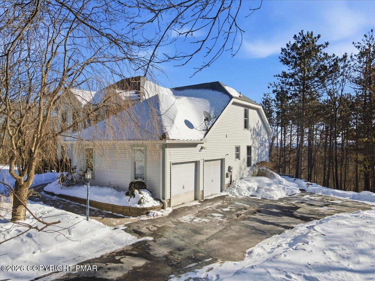 8824 Laird Road Stroudsburg, PA 18360 - Photo 29 of 53 a house with trees in front of it