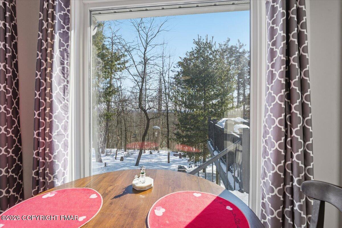 8824 Laird Road Stroudsburg, PA 18360 - Photo 34 of 53 a view of a bedroom with a bed and a chair