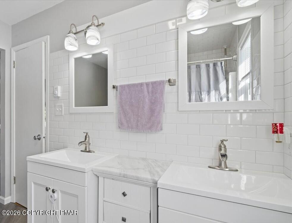 8824 Laird Road Stroudsburg, PA 18360 - Photo 45 of 53 a bathroom with a sink and a mirror