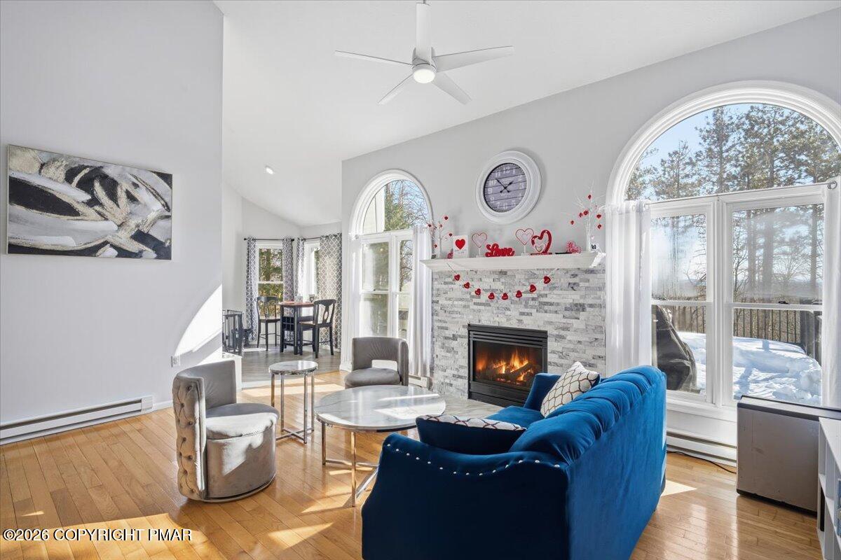 8824 Laird Road Stroudsburg, PA 18360 - Photo 6 of 53 a living room with furniture and a fireplace