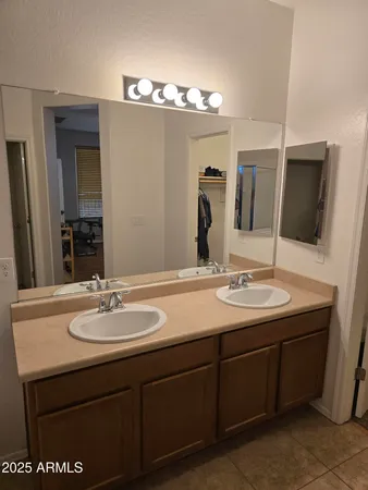 a bathroom with a shower and a sink