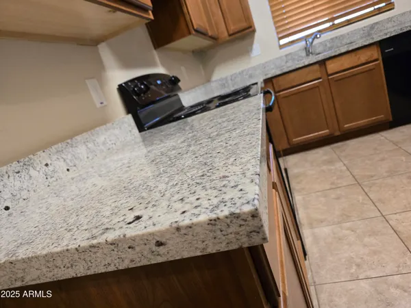 a stove top oven sitting inside of a kitchen