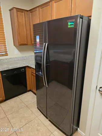 a kitchen with granite countertop a sink and a stove
