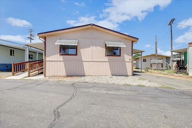 a front view of a house with a garage
