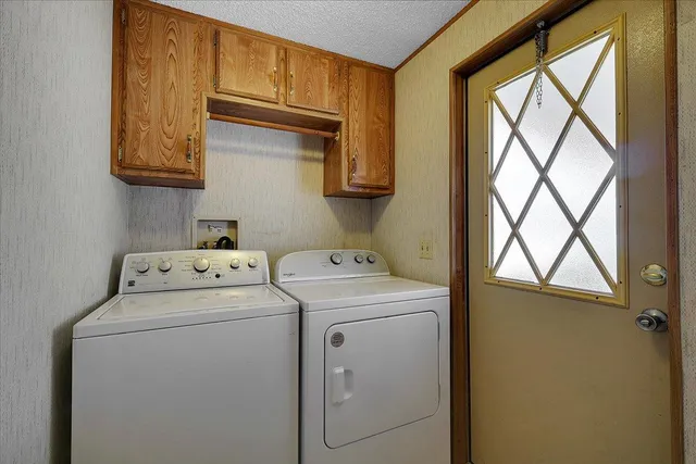 a view of storage and utility room with washer and dryer