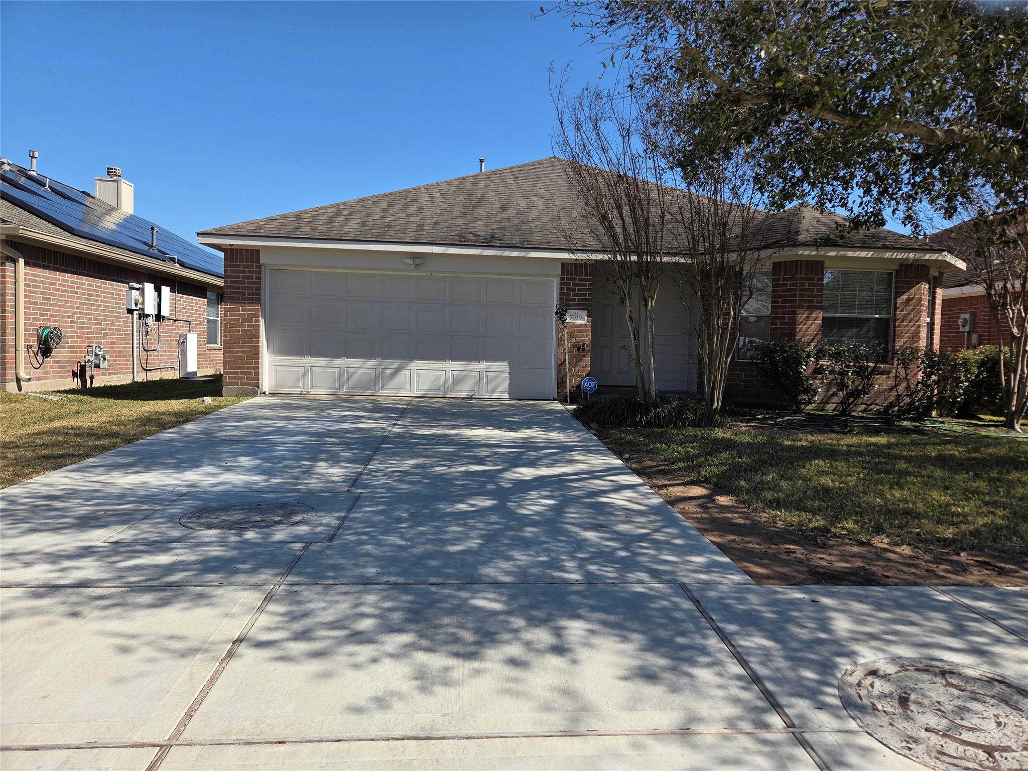 7019 Brody Lane Houston, TX 77083 - Photo 1 of 26 a view of a car garage