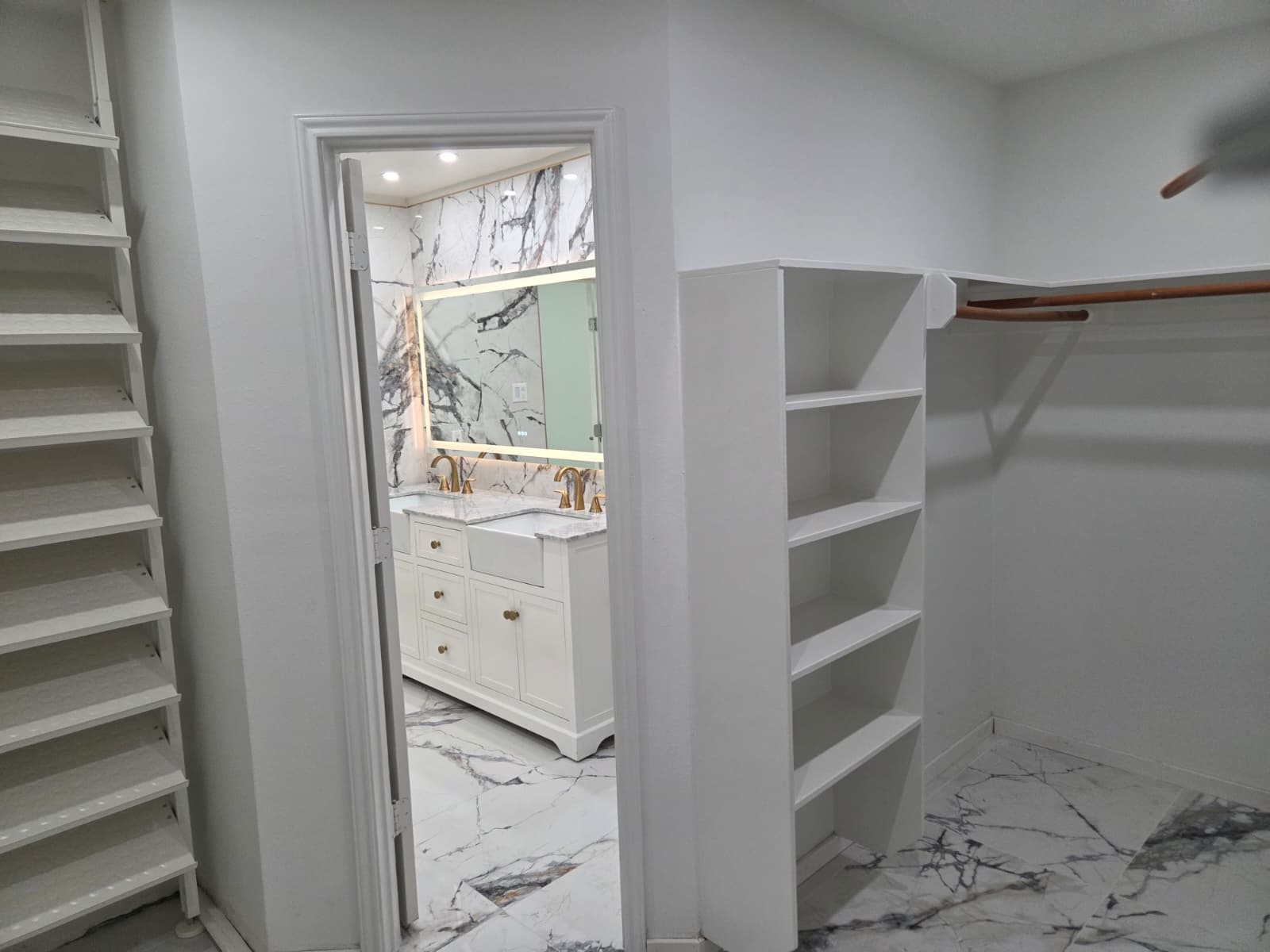 7019 Brody Lane Houston, TX 77083 - Photo 14 of 26 a view of walk in closet with empty racks