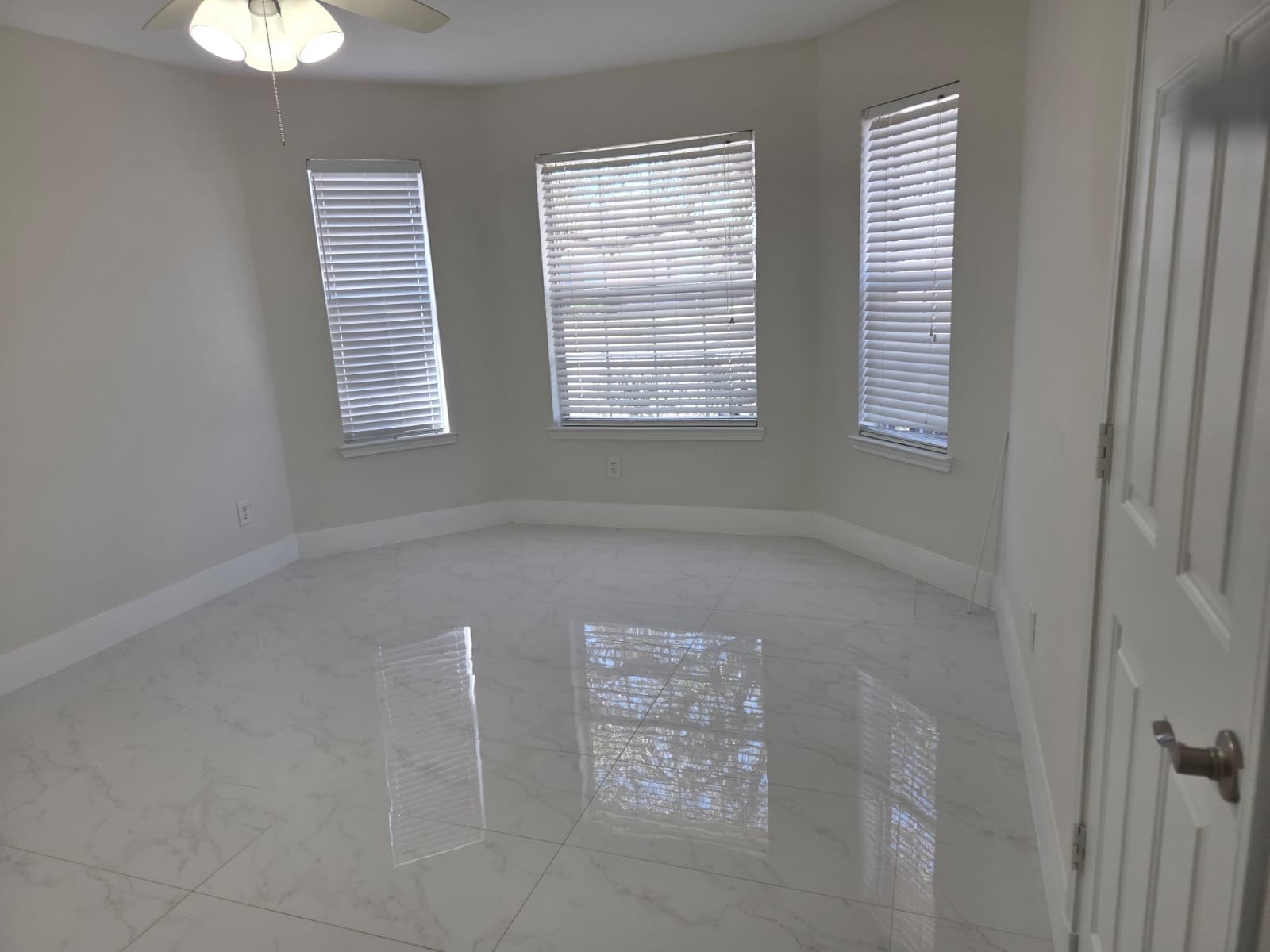 7019 Brody Lane Houston, TX 77083 - Photo 20 of 26 a view of an empty room with windows
