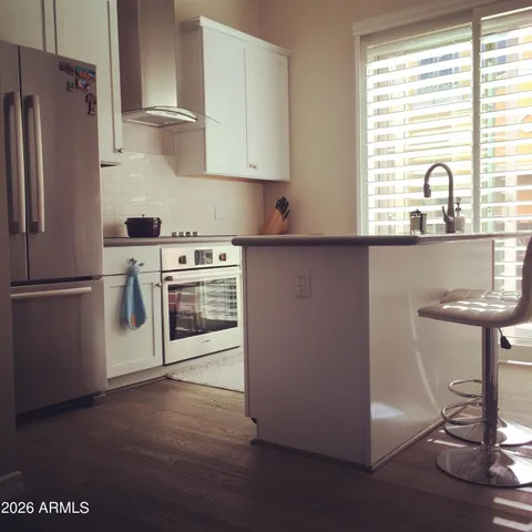a kitchen with a refrigerator and a sink