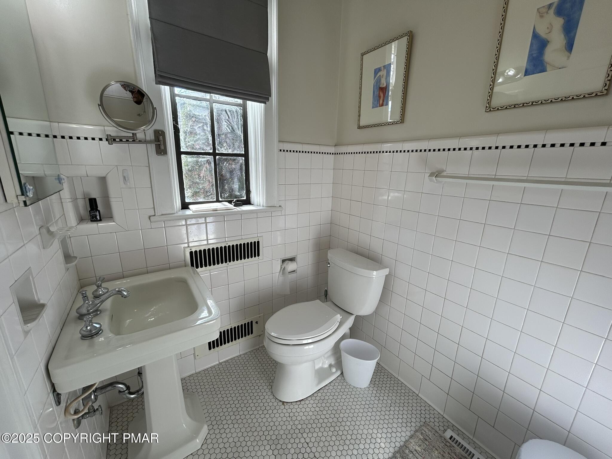 540 Sarah Street, Unit 102 Stroudsburg, PA 18360 - Photo 11 of 12 a bathroom with a sink toilet and shower