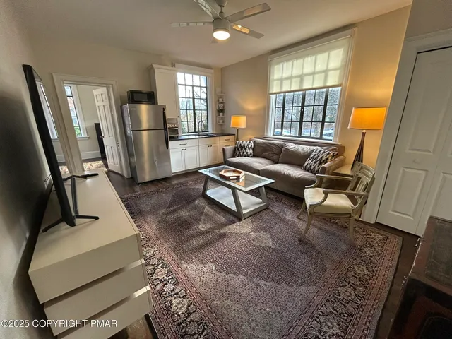 a living room with furniture and a window