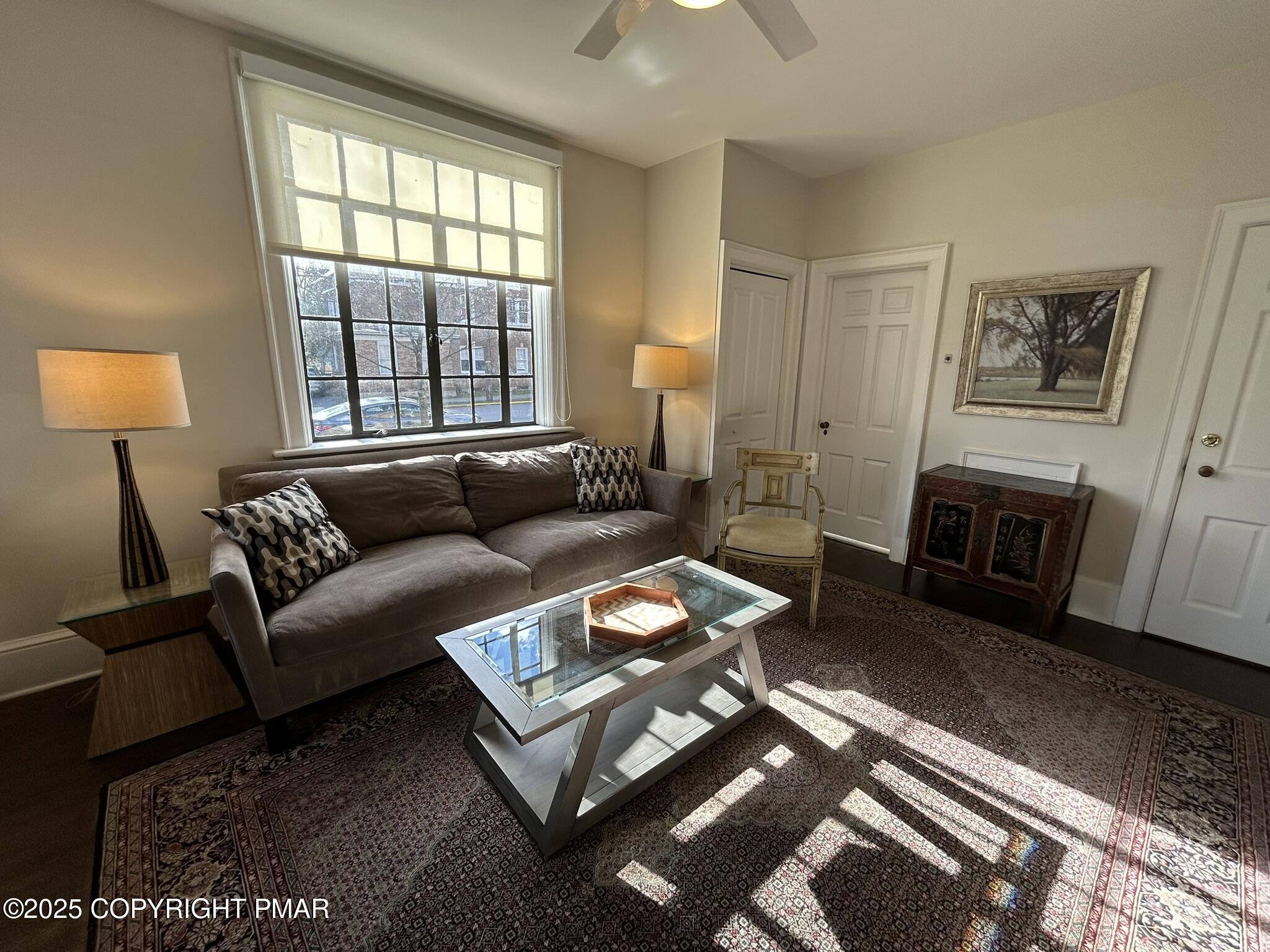 540 Sarah Street, Unit 102 Stroudsburg, PA 18360 - Photo 5 of 12 a living room with furniture and a fireplace