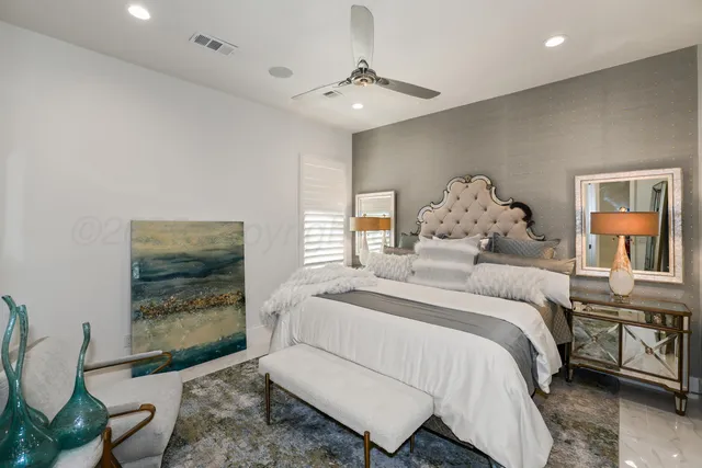 a bedroom with a large bed and a window