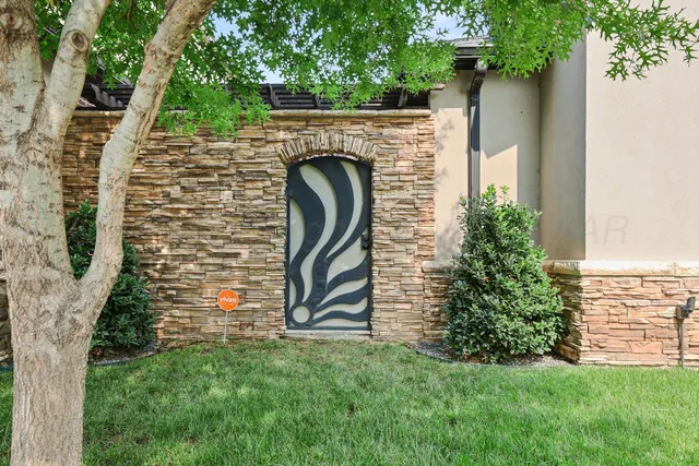 a view of front door of house with stairs