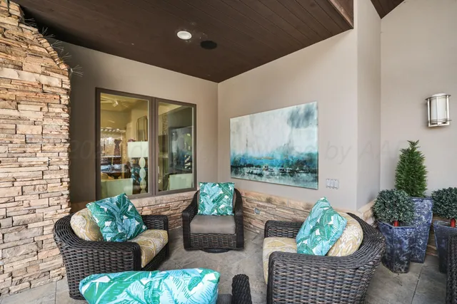 a front view of a house with garden and trees