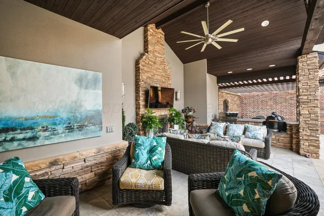 a front view of a house with a garden and plants