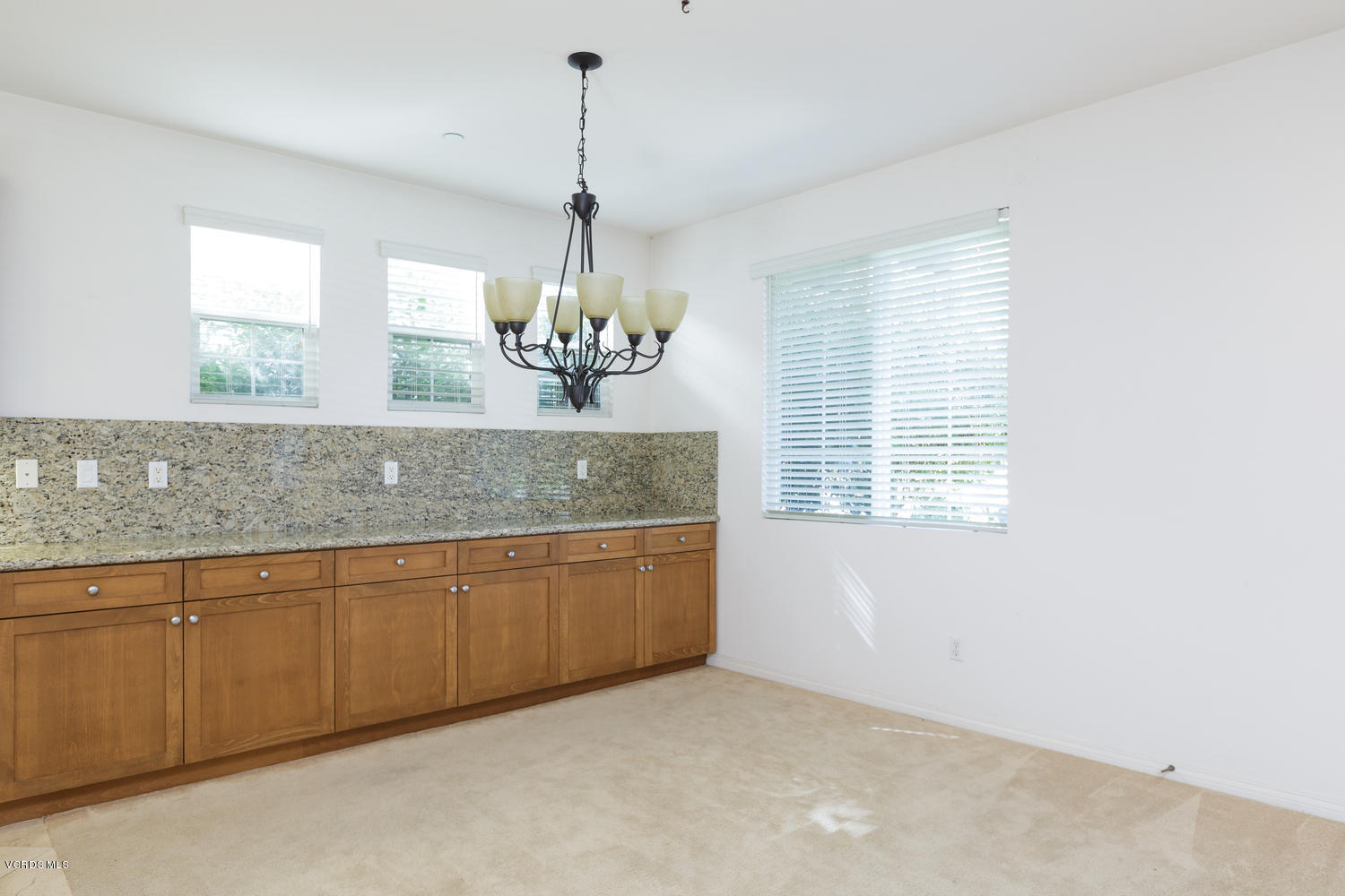 1455 Donegal Way Oxnard, CA 93035 - Photo 11 of 32 a view of a kitchen with granite countertop cabinets a sink and dishwasher