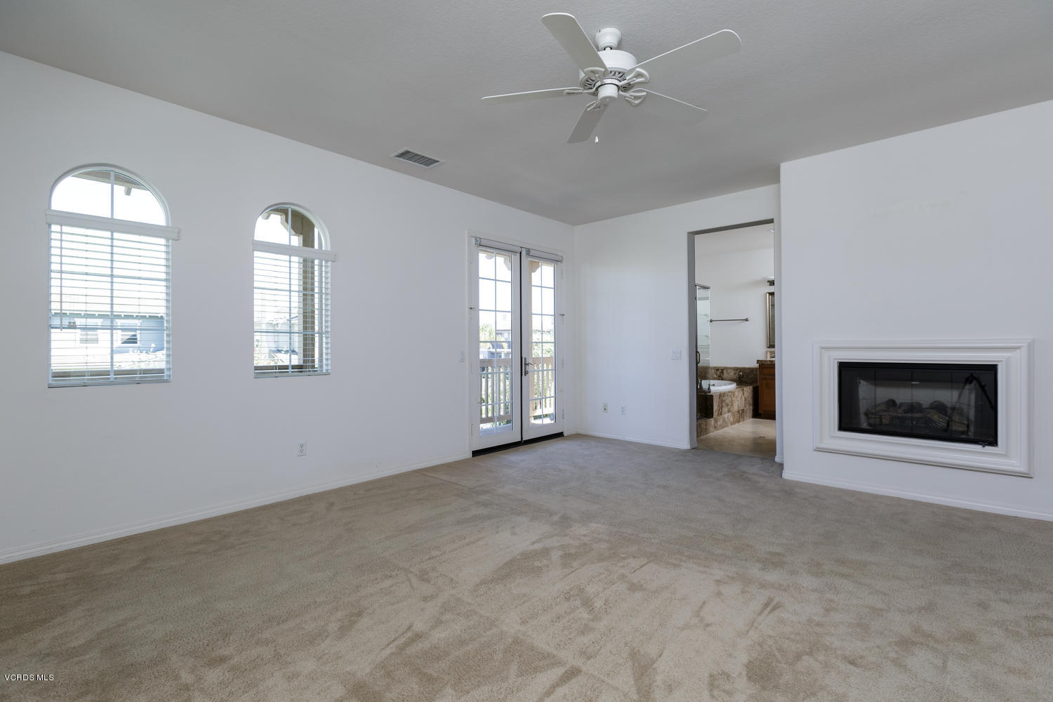 1455 Donegal Way Oxnard, CA 93035 - Photo 16 of 32 an empty room with windows and fireplace