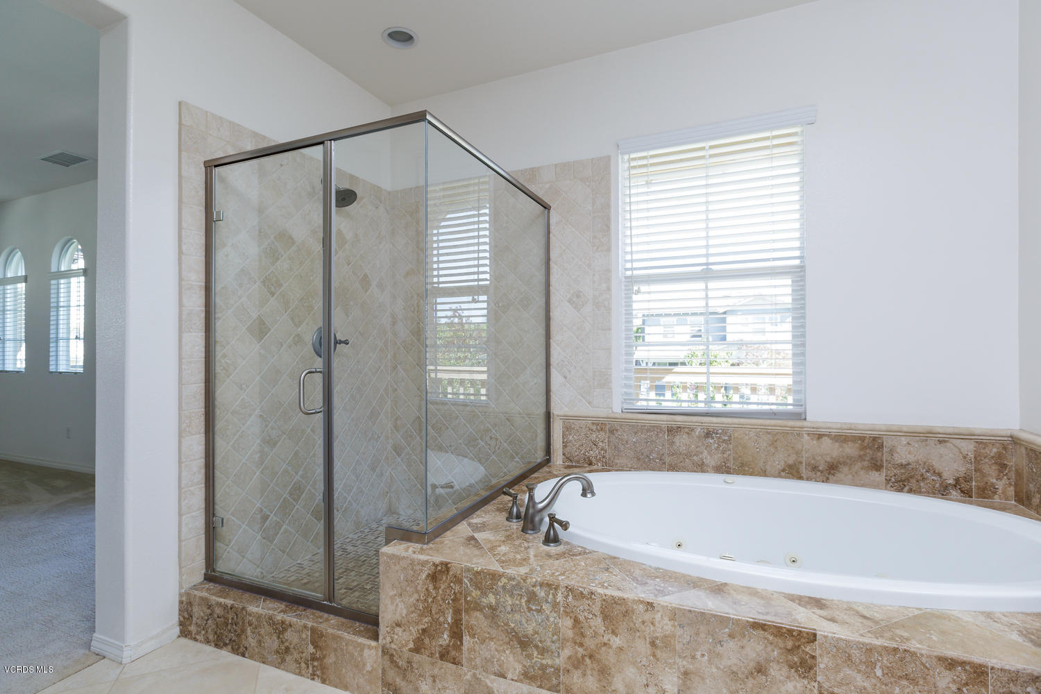 1455 Donegal Way Oxnard, CA 93035 - Photo 20 of 32 a bathroom with a bathtub and shower