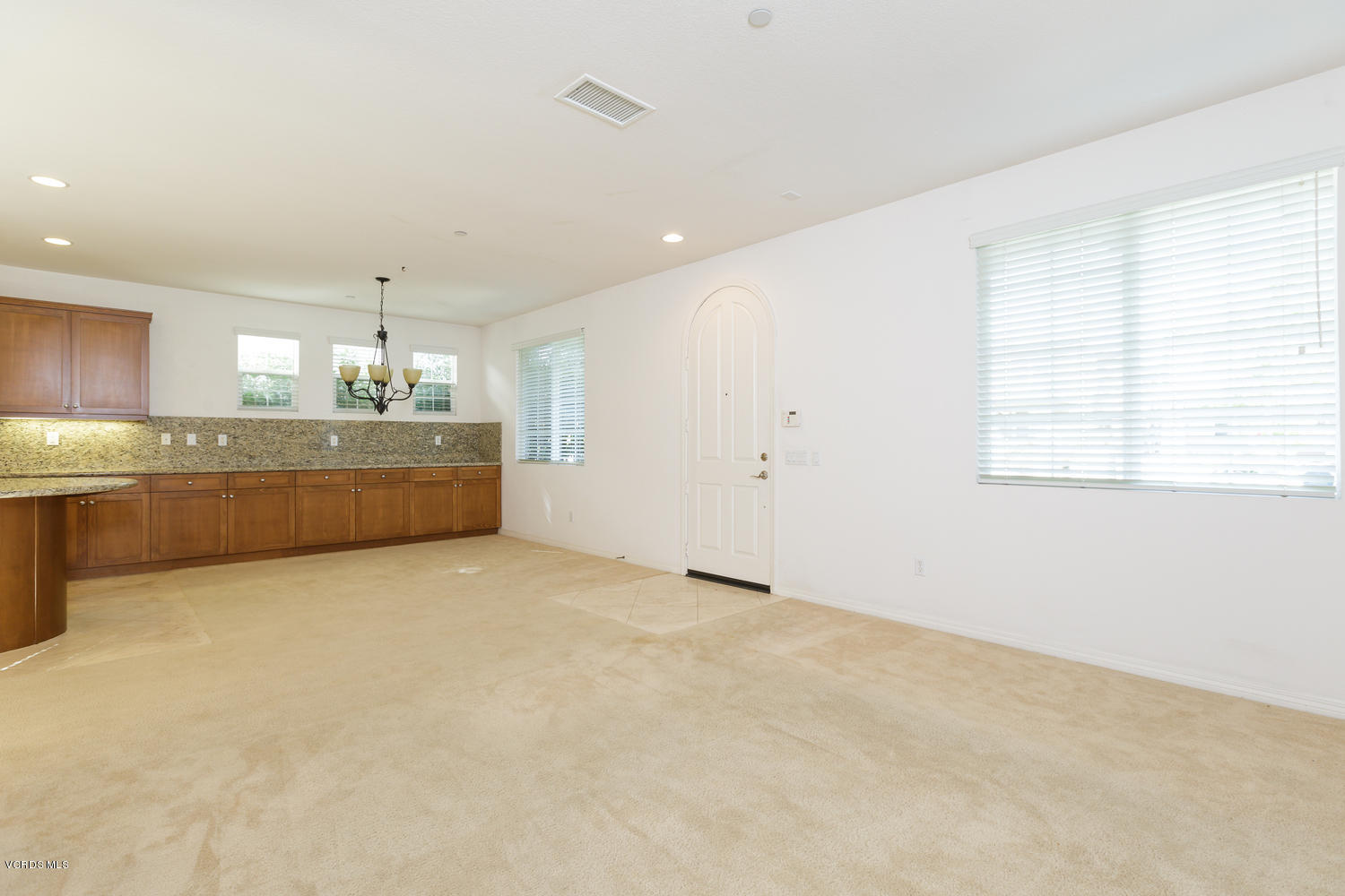 1455 Donegal Way Oxnard, CA 93035 - Photo 4 of 32 a large white kitchen with a refrigerator a sink dishwasher and a stove