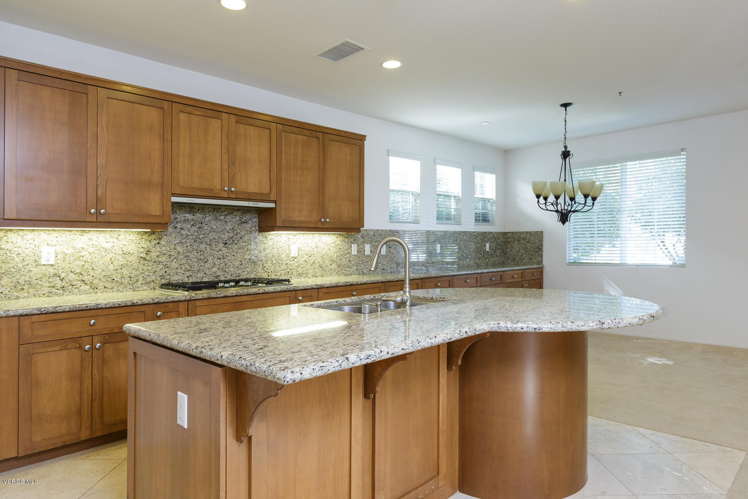1455 Donegal Way Oxnard, CA 93035 - Photo 8 of 32 a kitchen with granite countertop a sink a counter top space cabinets and stainless steel appliances