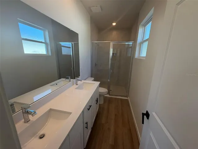 a bathroom with a sink and mirror