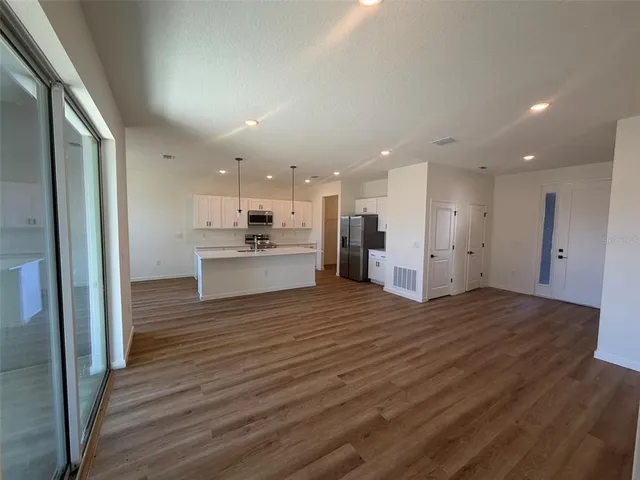 a view of kitchen with wooden floor