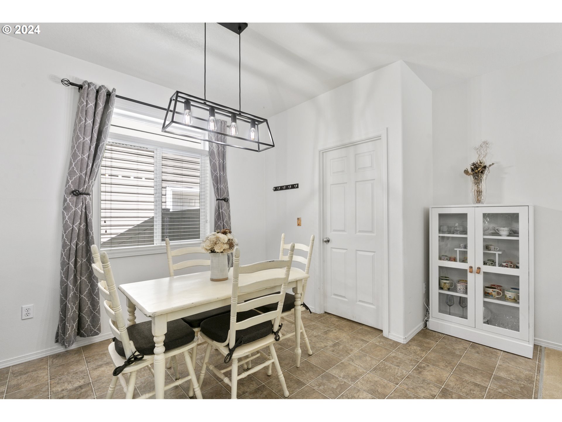3041 South Cedar Ridge Drive Ridgefield, WA 98642 - Photo 7 of 26 a view of a dining room with furniture and a window