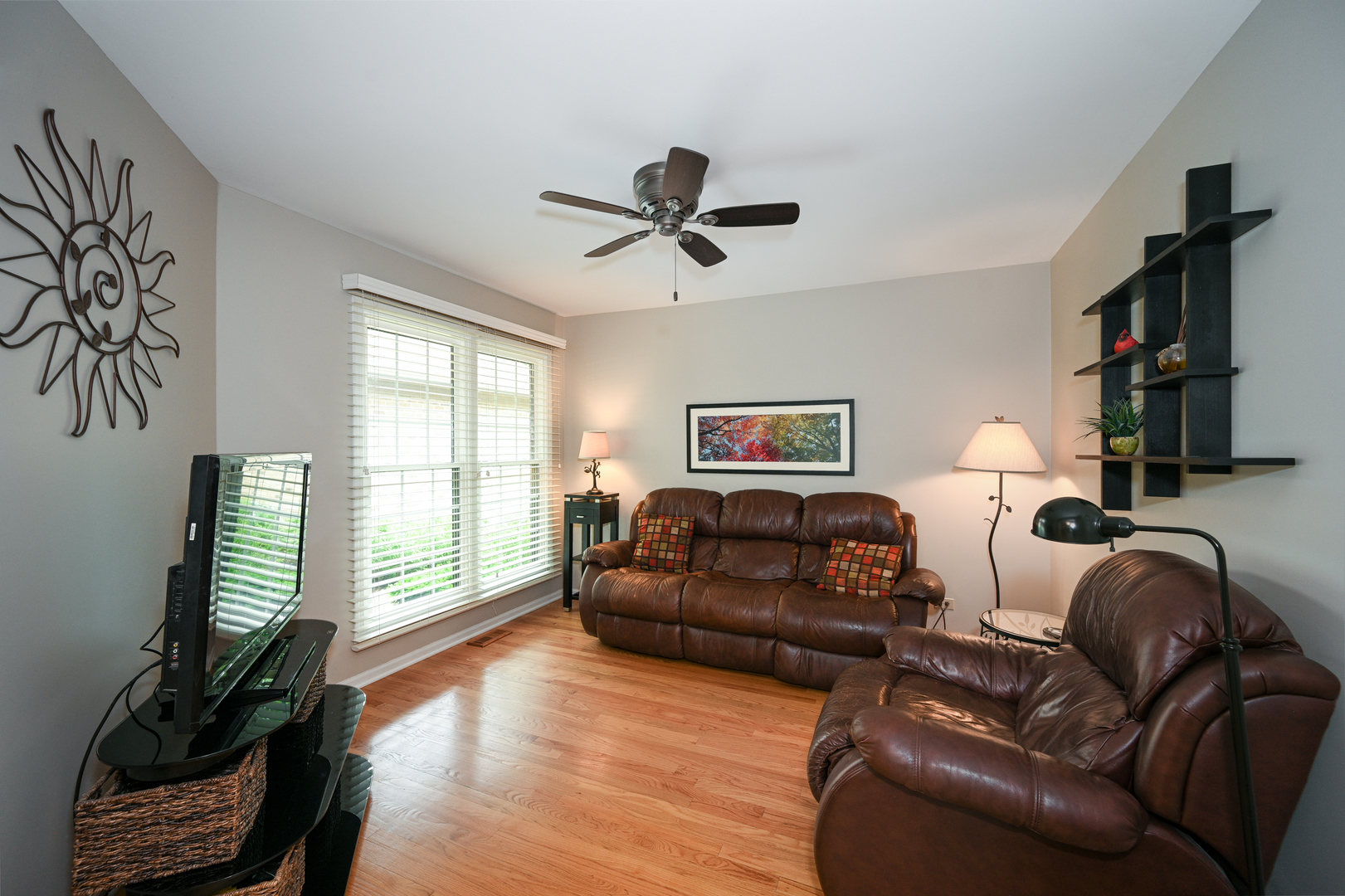 N692 Chelsea Circle Winfield, IL 60190 - Photo 4 of 28 a living room with furniture a flat screen tv and a large window