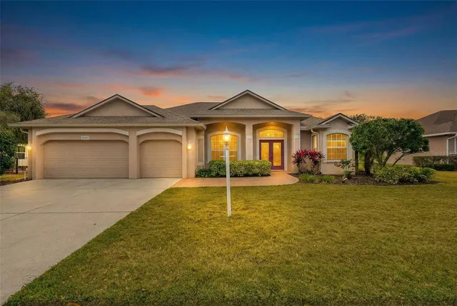 a balcony with furniture and a floor to ceiling window