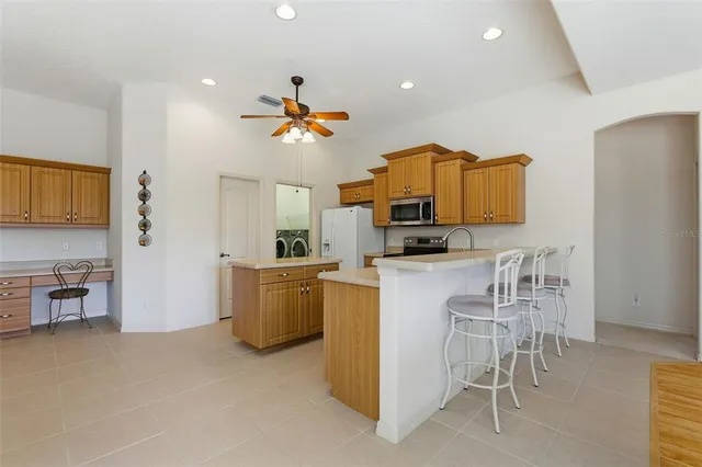 a bedroom with a bed and flat screen tv