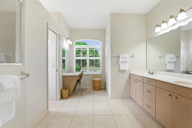 a bedroom with a bed and a night stand