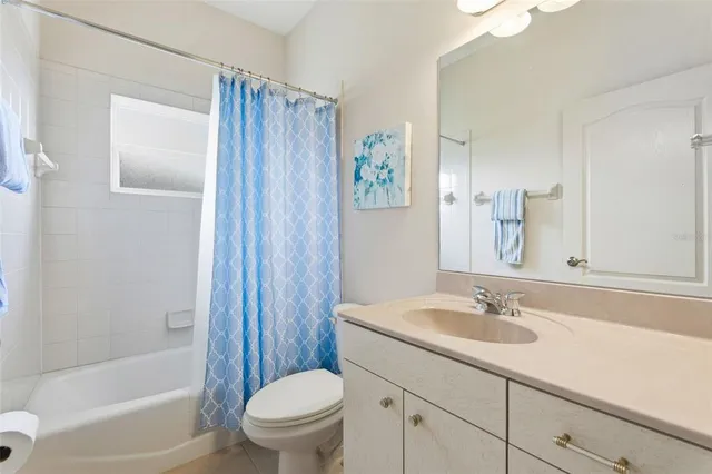 a view of a bathroom that has a window in it