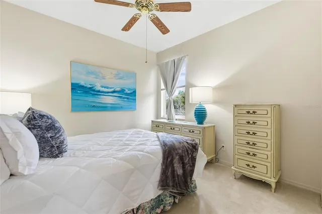 a living room with couch and a large window