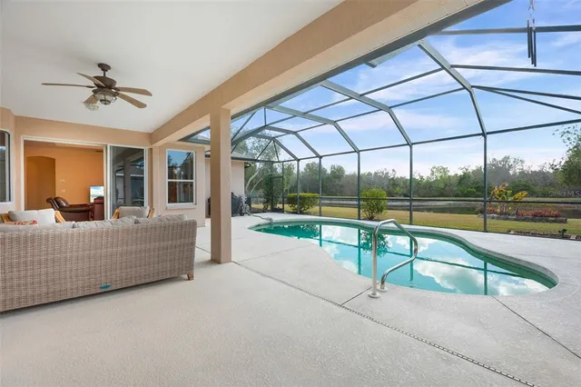 a front view of a house with swimming pool and porch