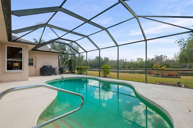 an aerial view of residential house with outdoor space and parking
