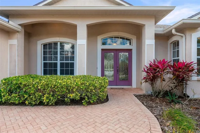 a view of a room with wooden floor and windows