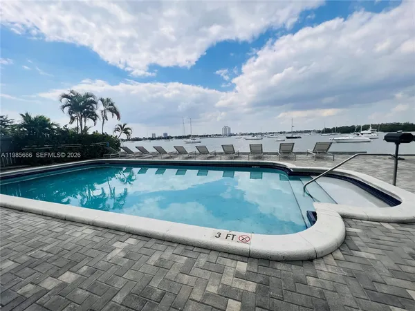 a view of a swimming pool with a terrace