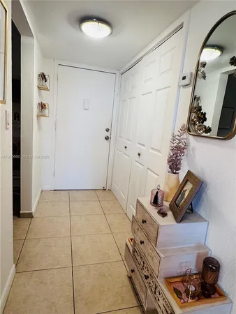 a kitchen with a stove sink and cabinets