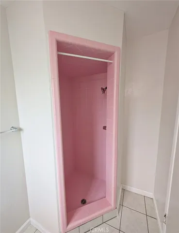 a bathroom with a glass shower door
